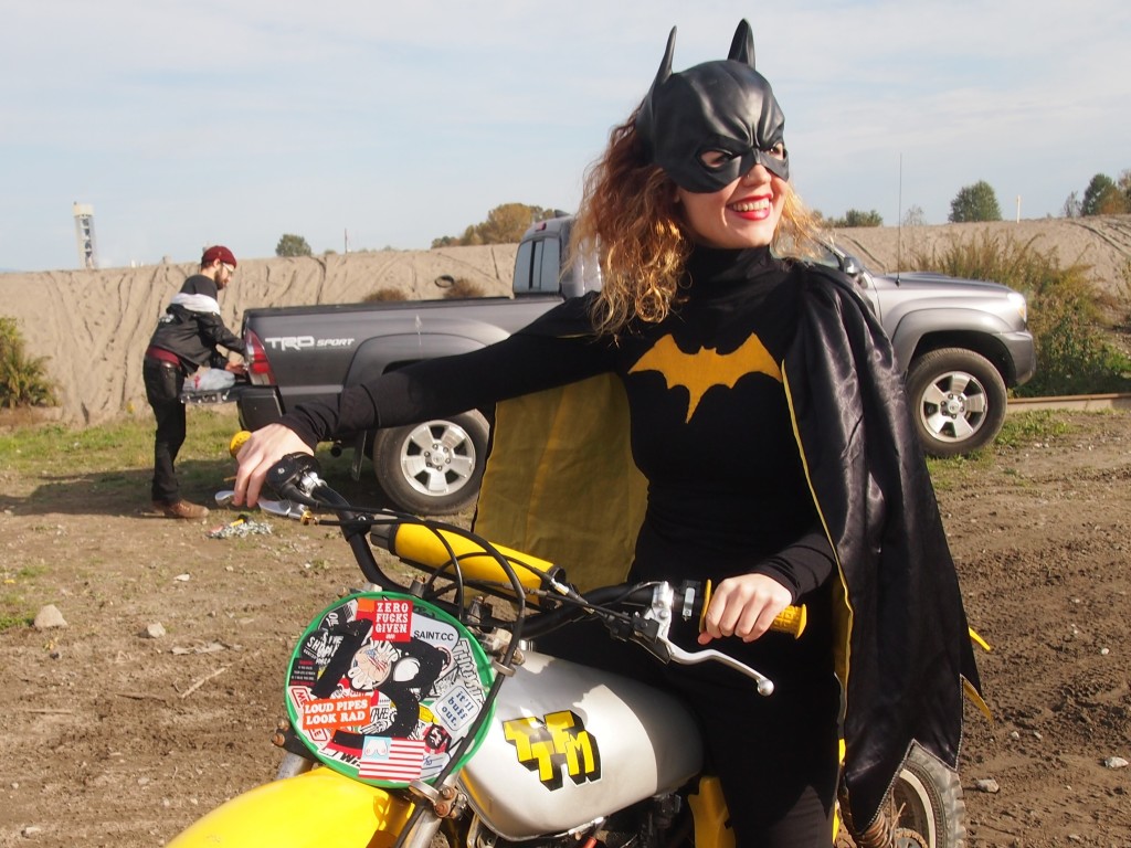 Batgirl posing on a dirtbike at the High Noon Scramble 2015