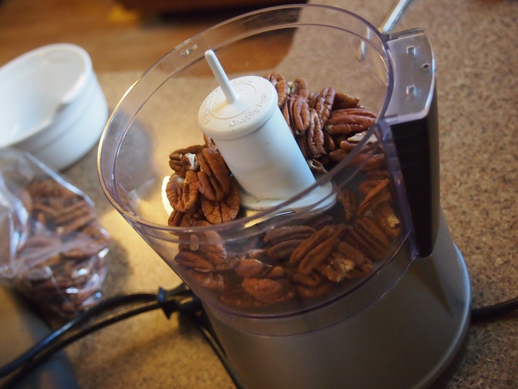 Pecans for rolling the thumbprint cookies in