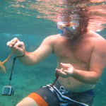Playing with sea life while snorkeling in Guadeloupe