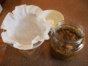 Straining the dandelion tea to make jelly