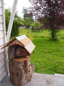 The mason bee log house in it's home