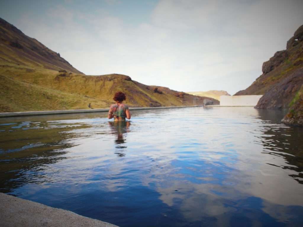 Swimming in seljavallalaug pool in south Iceland on my road trip