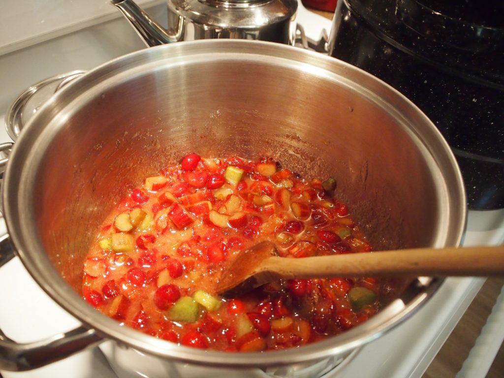 cooking the fruit down to make cherry rhubarb jam